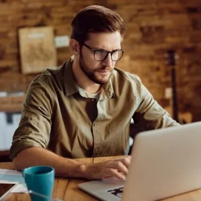 male-entrepreneur-working-computer-home_637285-12152-e1703099686545